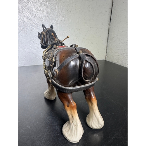 595 - Pair of Beswick-Style Shire Horses with Full Harness (Shipping Available).

A charming pair of ceram... 
