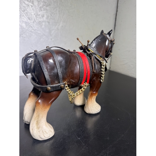 595 - Pair of Beswick-Style Shire Horses with Full Harness (Shipping Available).

A charming pair of ceram... 
