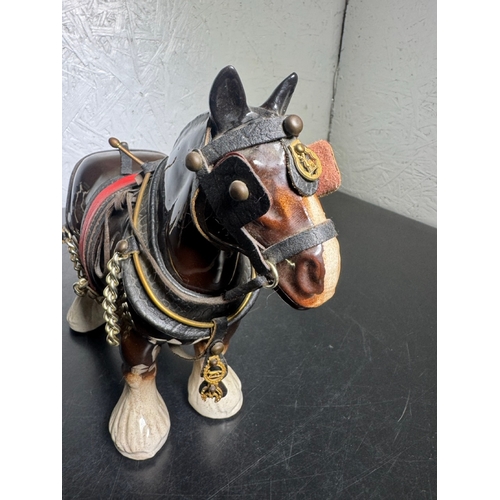 595 - Pair of Beswick-Style Shire Horses with Full Harness (Shipping Available).

A charming pair of ceram... 