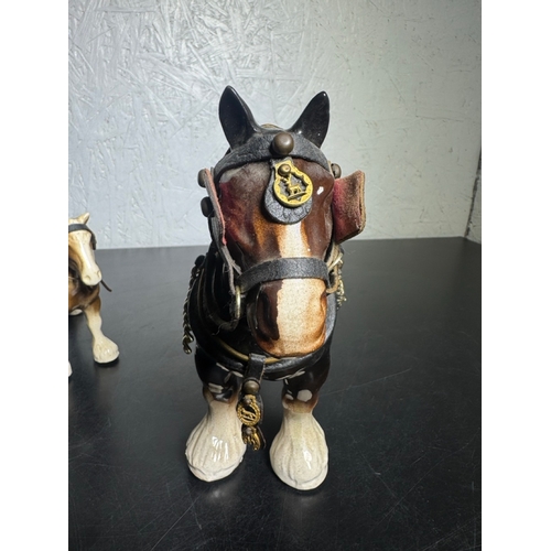 595 - Pair of Beswick-Style Shire Horses with Full Harness (Shipping Available).

A charming pair of ceram... 