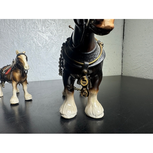 595 - Pair of Beswick-Style Shire Horses with Full Harness (Shipping Available).

A charming pair of ceram... 