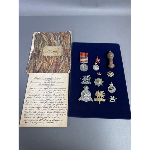 Boer War 1901 medal group with handwritten diary, campaign medals, regimental cap badges and insignia — UK & international shipping available.

2 x Handwritten diaries, One titled "One a voyage from Southampton to Cape Town" 1901.  The second is titled "Experiences in the South African Constabulary" 1901 whilst under General Baden Powell. Quite an interesting read.

The seller has brought a number of items in this auction that were the personal effects of Mr Ernest Muxworthy. 

Queen's South Africa Medal for service during the Boer War with 4 Clasps:  South Africa 1902, Cape Colony, South Africa 1901, Orange Free State. Awarded to 1716 3rd CL. Trooper Ernest Muxworthy S.A.C. South African Constabulary;
Centenary of Victoria & Melbourne 1934 1935 Medal & Ribbon;
2 x The Buffs - Royal East Kent Regiment - Cap Badge;
2 x 1902-1908 South African Constabulary Cap Badge;
Coldstream Guards Brass Cap Badge; Monmouthshire Regiment Cap Badge;
British Army cap badge for The Devonshire Regiment;
Vintage Wooden Whistle;
Vintage Rhinestone Crown Brooch;
Handwritten Diary by Ernest Muxworthy detailing the voyage from Southampton to South Africa 1901.
