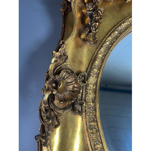 A Large 20th Century Rococo Revival Gilt Framed Wall Mirror A large ...