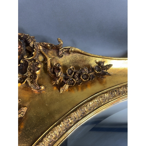 A Large 20th Century Rococo Revival Gilt Framed Wall Mirror A large ...