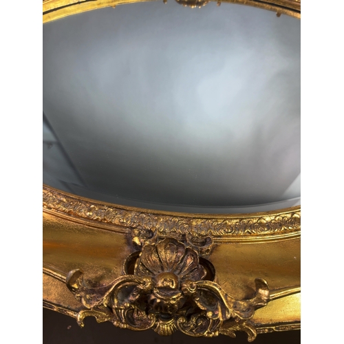 A Large 20th Century Rococo Revival Gilt Framed Wall Mirror A large ...
