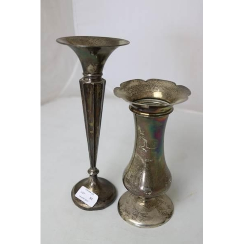 61 - A silver vase together with another similar