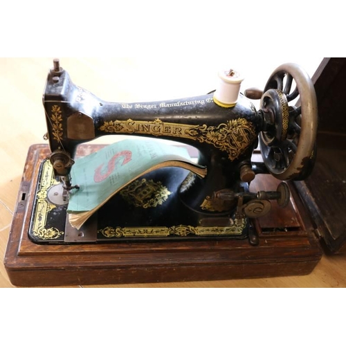 79 - A vintage oak cased sewing machine