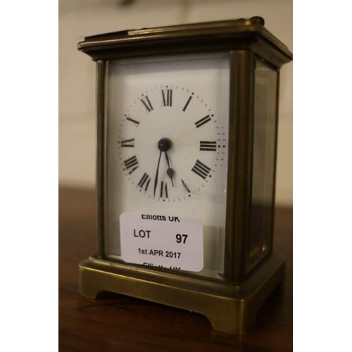 97 - A Brass cased Carriage clock and key