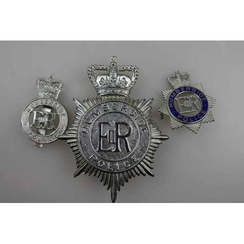 199 - An obsolete Humberside Police helmet badge together with obsolete Humberside Police cap badge and en... 