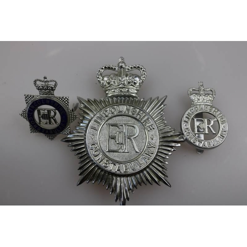 200 - An obsolete Lincolnshire Constabulary helmet badge together with obsolete Lincolnshire Constabulary ... 