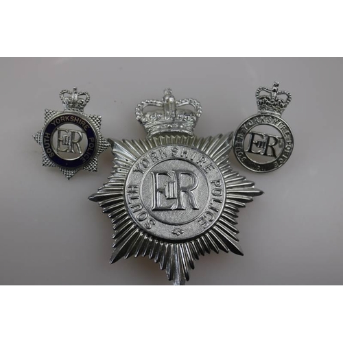 204 - An obsolete South Yorkshire Police helmet badge together with obsolete South Yorkshire Police cap ba... 