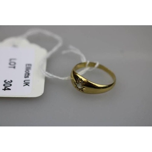 304 - An 18ct gold ring set with diamond.  Approx weight 3.97g.