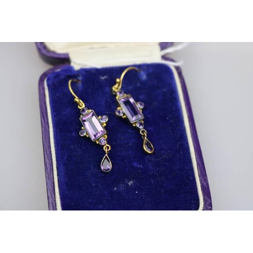 309 - A 9k gold and silver gilt set with Amethyst pair of earrings