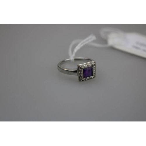 320 - A Diamond and Amethyst 9ct white gold ring