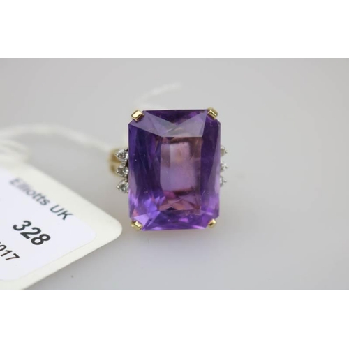 328 - A unmarked yellow metal ring set with single large amethyst embellished with 3 small diamonds each s... 