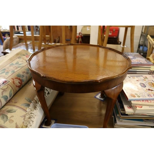 553 - A 1930's piecrust edge coffee table in stained oak