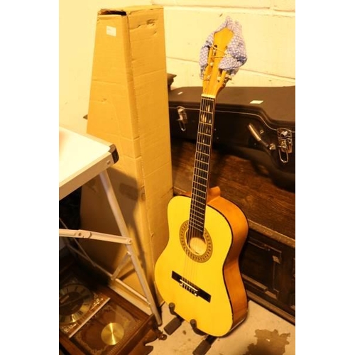 544 - Two beginners guitars together with a guitar stand