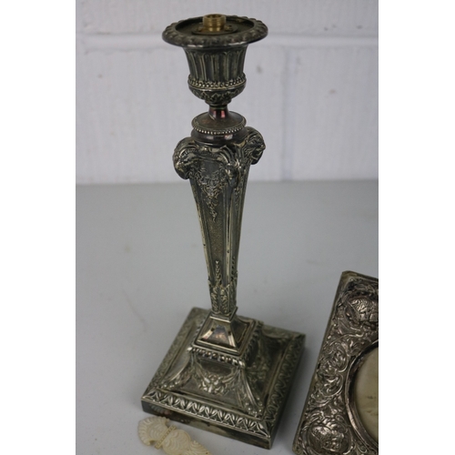 76 - Plated candlestick, Silver cherub frame and a ladle