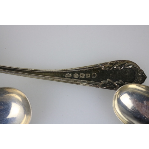 81 - A good selection of silver spoons together with a ladle and two silver souvenir spoons