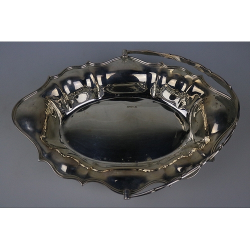 108 - A silver decorative basket with handle