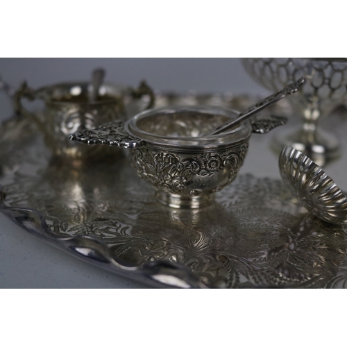 142 - A good quality silver plated tray together with a selection of silver items