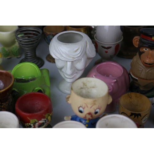 214 - Large collection of assorted egg cups