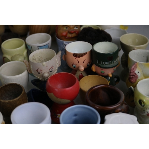 214 - Large collection of assorted egg cups