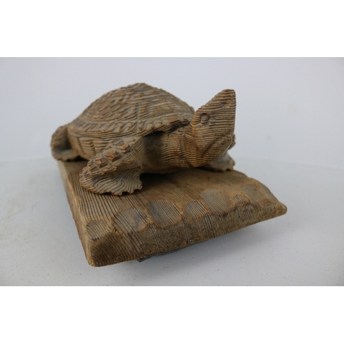 257 - Carved wooden tortoise on weighted base