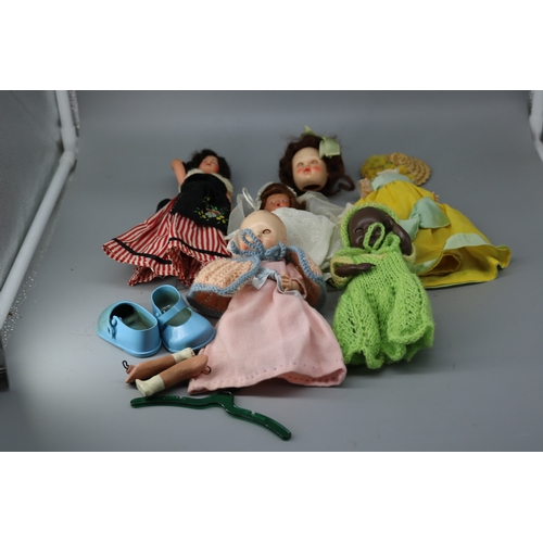 111 - A box containing miniature celluloid and other dolls (some A/f) to include Miss rosebud