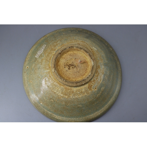 257 - An early Celadon bowl approx 7