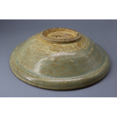 257 - An early Celadon bowl approx 7