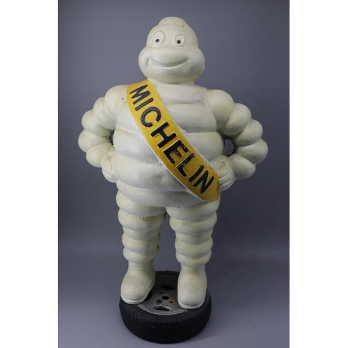 208 - A cast Michelin man on tyre (approx H38.5cm)