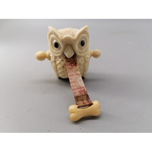 222 - A bone carved owl tape measure (approx height 6cm)