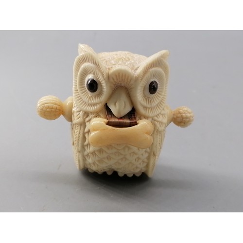 222 - A bone carved owl tape measure (approx height 6cm)