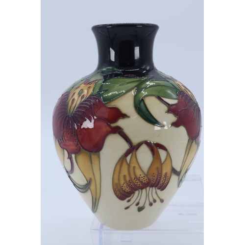 12 - A Moorcroft vase in the Anna Lily design (approx 17cm tall) impressed marks to base