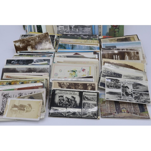 21 - A carton full of postcards of mixed years and themes