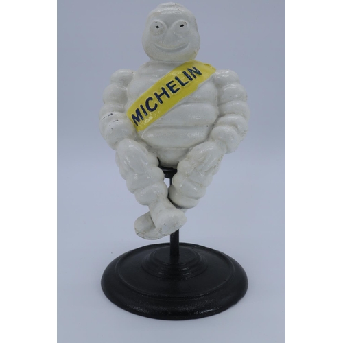 30 - A Michelin man on spinning stool base (measure approx 12