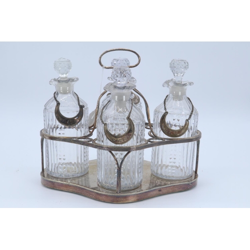 34 - Silver plated decanter set comprising 4 decanters all with labels