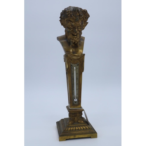 41 - An antique decorative gilt bronze thermometer decorated with the bust of Baccus seated on column bas... 