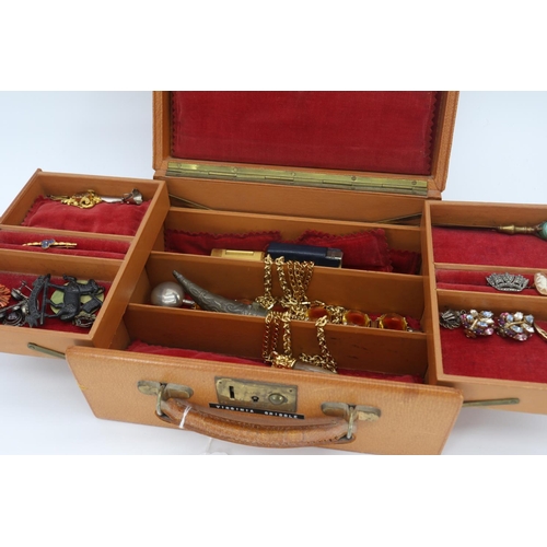 121 - A vintage jewellery box including contents of costume jewellery, goldtone necklaces, 2 Dunhill light... 