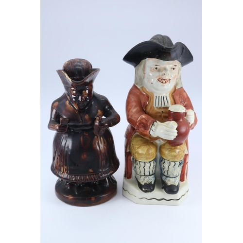 93 - Treacle glaze antique Toby Jug together with a Staffordshire Toby Jug