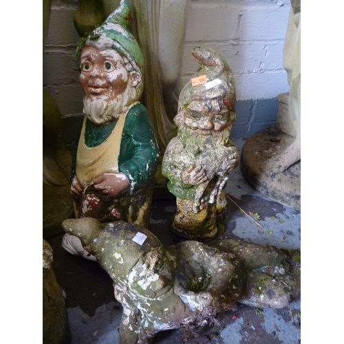 752 - Three gnomes, one smoking a pipe