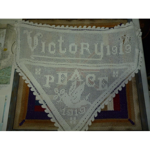 218a - An interesting lot containing a needlework panel from 1916 depicting flags of nations and bearing R.... 