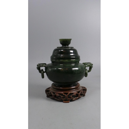 39A - Jade carved decorative pot and top on carved stand (measures approx. 9.5cm off stand) noted hairline... 