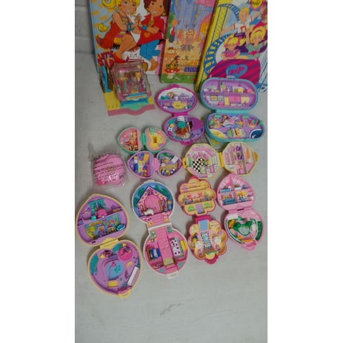 138 - A selection of polly pocket playsets not checked for completeness together with annuals etc