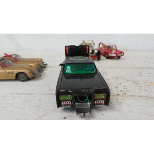 50 - A group of Corgi TV themed vehicles; 2 x 007 Aston Martins, one with both passenger and driver, the ... 