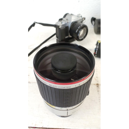 131 - A Canon AL-1 with automatic winder, a Sigma Mirror Telephoto 600mm lens and a Tokina Doubler.