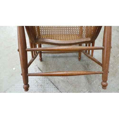 700 - An oak and cane chair