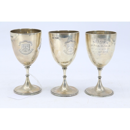 11 - Three silver hallmarked small trophies from Hitchin Grammar School both dated May 31st 1909, weigh a... 