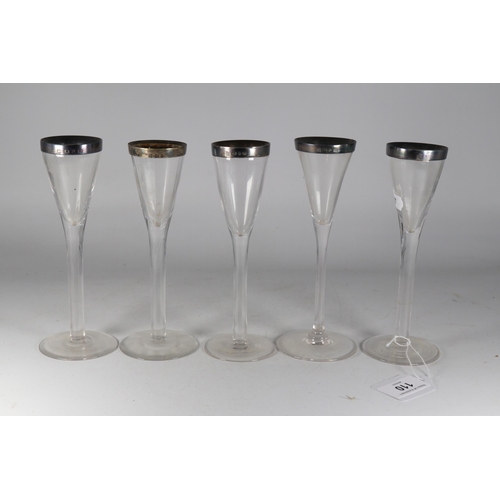 110 - Five silver rimmed aperitif glasses